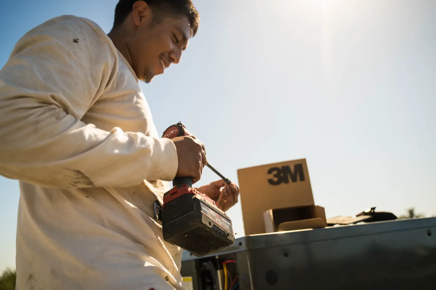 Golden Valley Heating and Air technician servicing rooftop HVAC equipment — photo 2