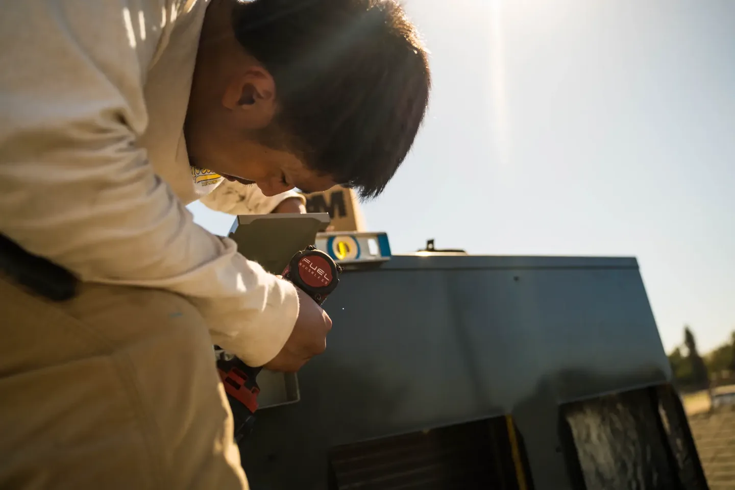 Golden Valley Heating and Air technician servicing rooftop HVAC equipment — photo 4