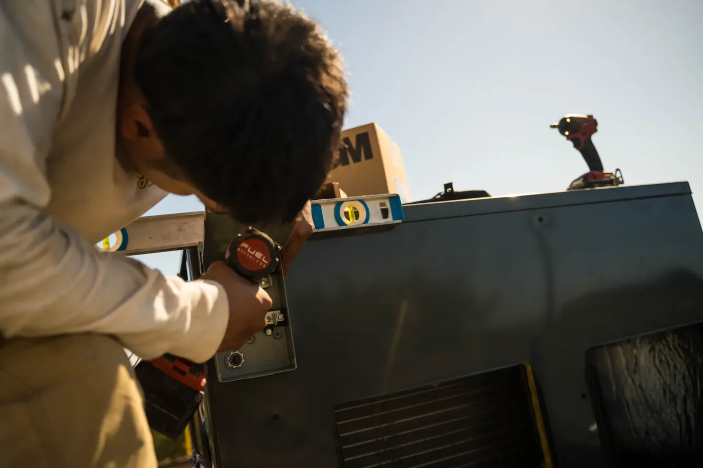 Golden Valley Heating and Air technician servicing rooftop HVAC equipment — photo 6