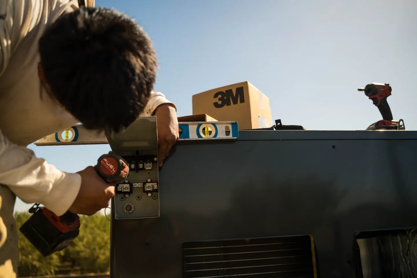 Golden Valley Heating and Air technician servicing rooftop HVAC equipment — photo 7