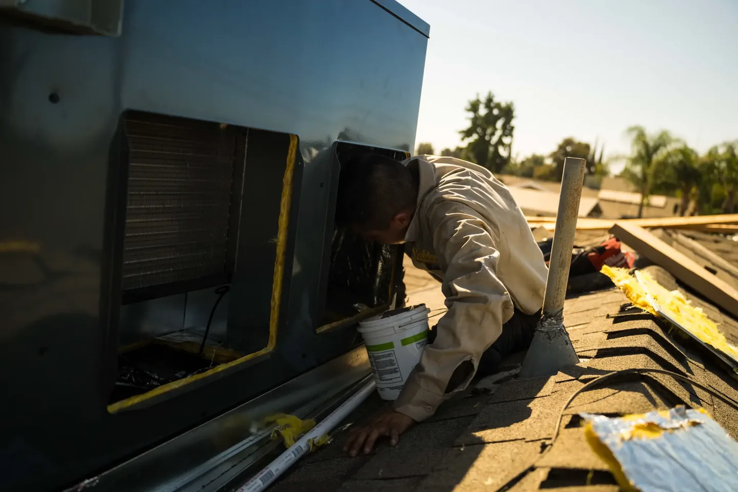 Golden Valley Heating and Air technician servicing rooftop HVAC equipment — photo 16