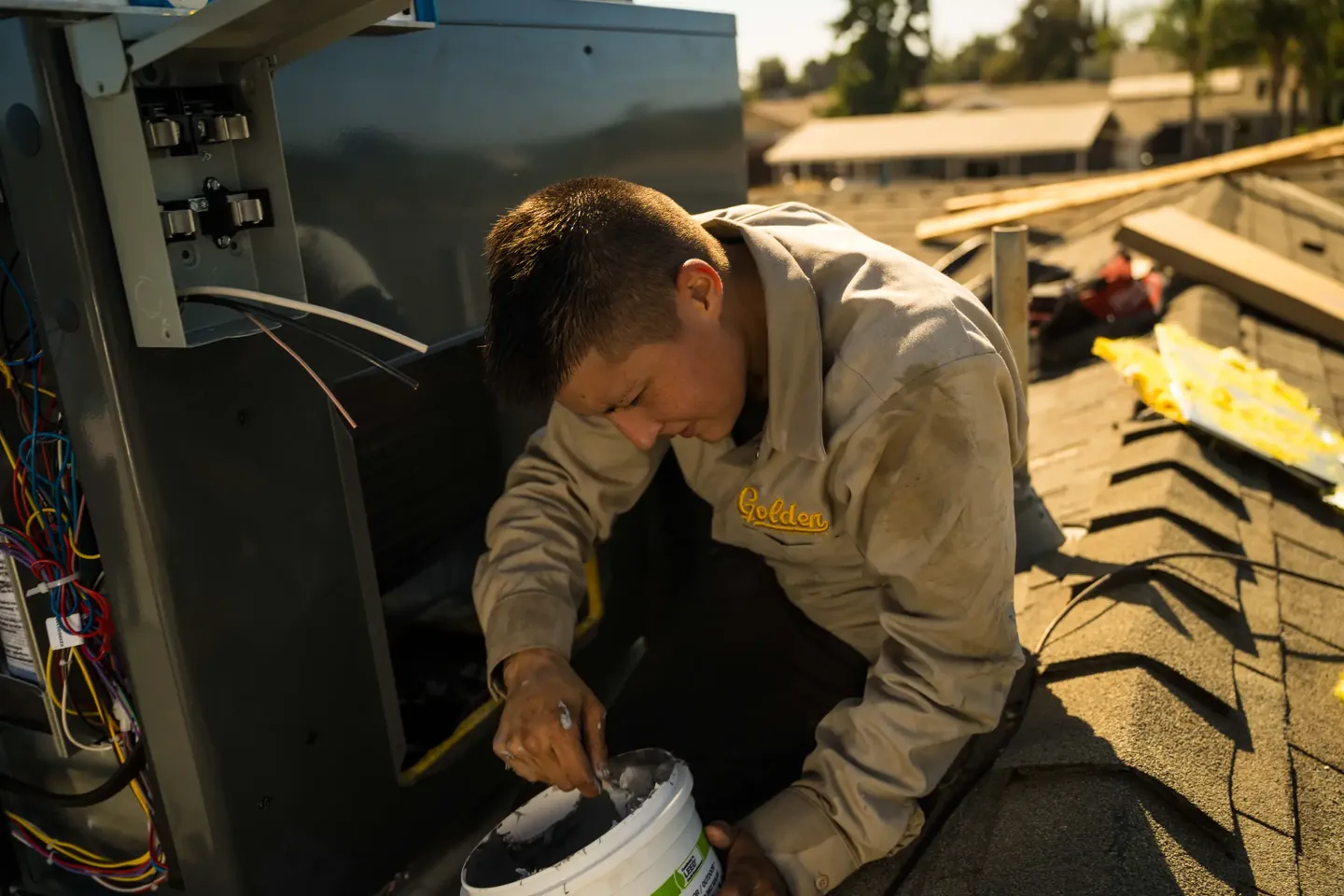 Golden Valley Heating and Air technician servicing rooftop HVAC equipment — photo 17