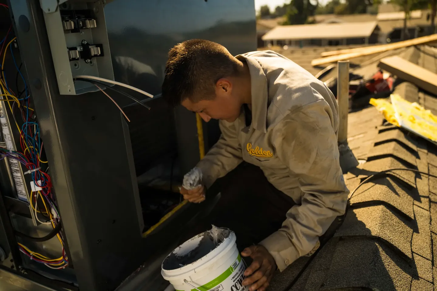 Golden Valley Heating and Air technician servicing rooftop HVAC equipment — photo 18